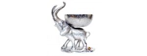 Elephant Bowl - Liberty Recycled Aluminium - Standing Elephant carrying a bowl: This divinely eccentric yet simple statement piece is made from beaten recycled aluminium by skilled craftsman The pitted, textured appearance adds a point of interest to the design giving each individual piece a unique character Lavishly popular up and down the land this lovely elephant bowl includes Free UK P&P *Main land only and currently excludes N.I Approximately 39 high, then 58 wide x 44 centimetres in depth – (H 39 x W 58 x D 44 cm) The price is for one piece, and please allow 14 : 21 days for dispatch from the point of purchase This amazing Liberty Recycled Aluminium Elephant Bowl is proudly “Sustainable, Affordable & Uniquely Different.”