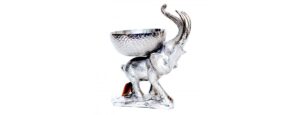 Liberty Recycled Aluminium - Standing Elephant carrying a bowl: This divinely eccentric yet simple statement piece is made from beaten recycled aluminium by skilled craftsman The pitted, textured appearance adds a point of interest to the design giving each individual piece a unique character Lavishly popular up and down the land this lovely elephant bowl includes Free UK P&P *Main land only and currently excludes N.I Approximately 39 high, then 58 wide x 44 centimetres in depth – (H 39 x W 58 x D 44 cm) The price is for one piece, and please allow 14 : 21 days for dispatch from the point of purchase This amazing Liberty Recycled Aluminium Elephant Bowl is proudly “Sustainable, Affordable & Uniquely Different.”